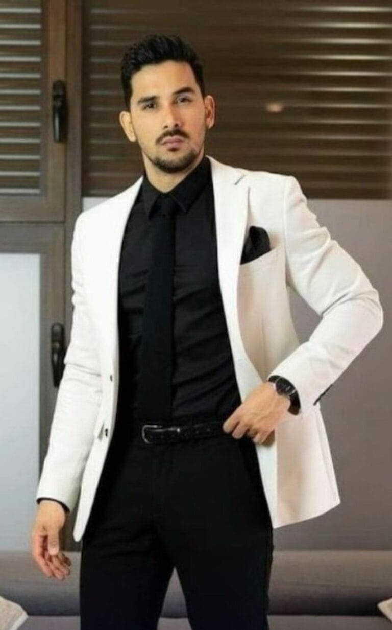 Man in a Stylish Black and White Suit – The Difference Between a Tux and a Suit