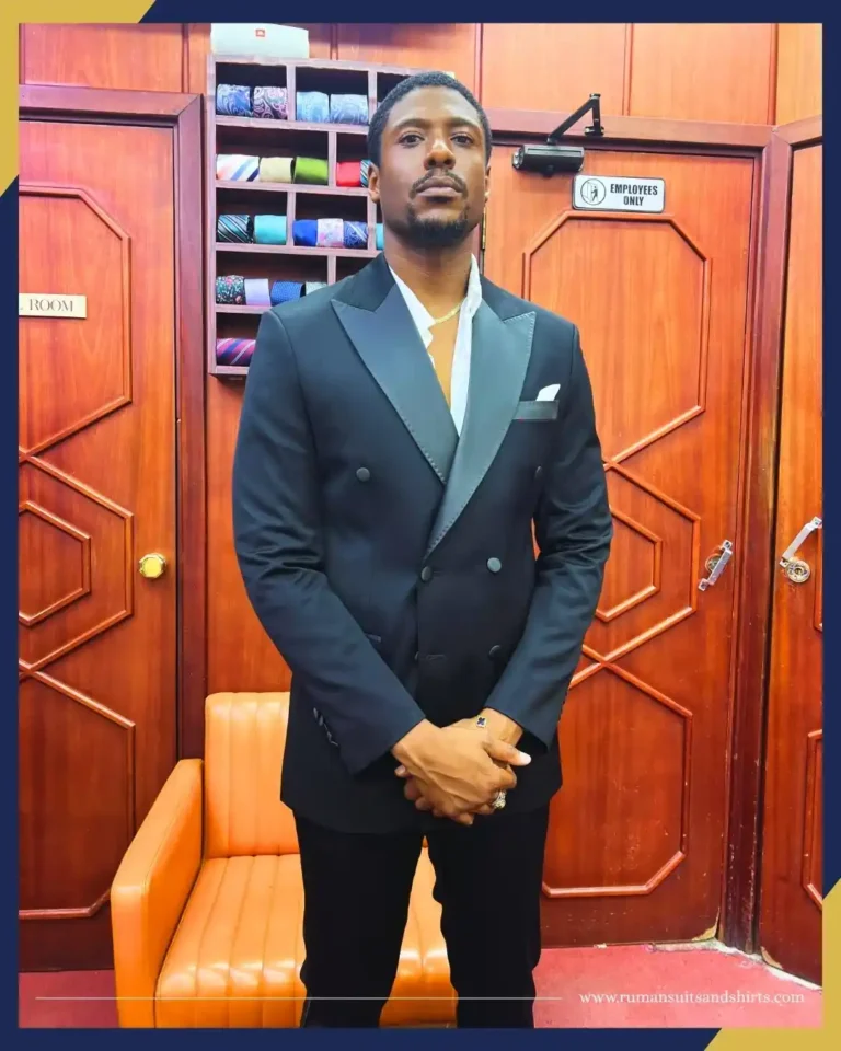 A professional tailor taking precise body measurements for a bespoke suit, showing how to choose the right tailor in Dubai for perfect fitting and craftsmanship.