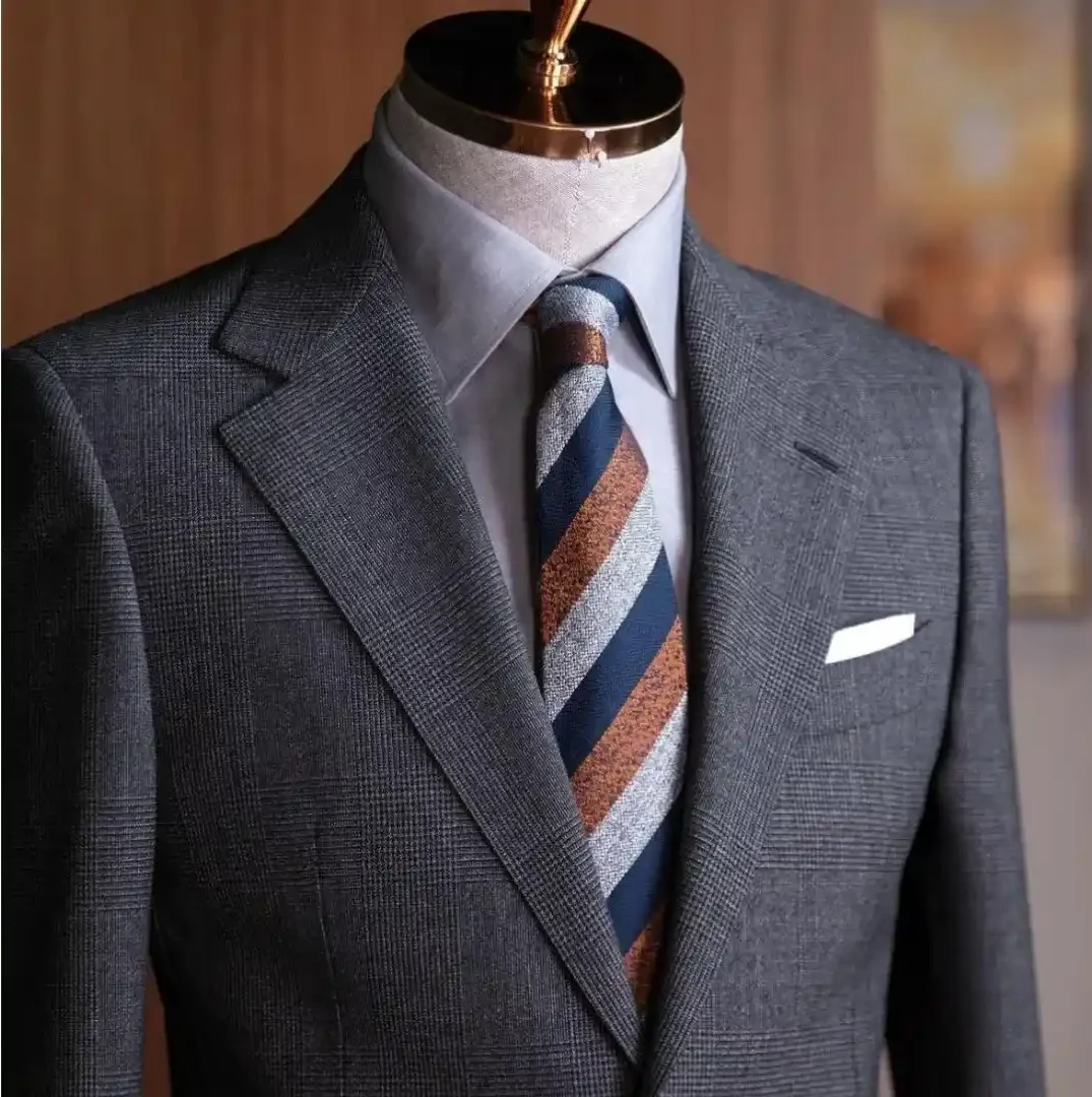 Bespoke suit displayed at Ruman Suits & Shirts, showcasing why Dubai is the leading Dubai hub for luxury mens tailoring.