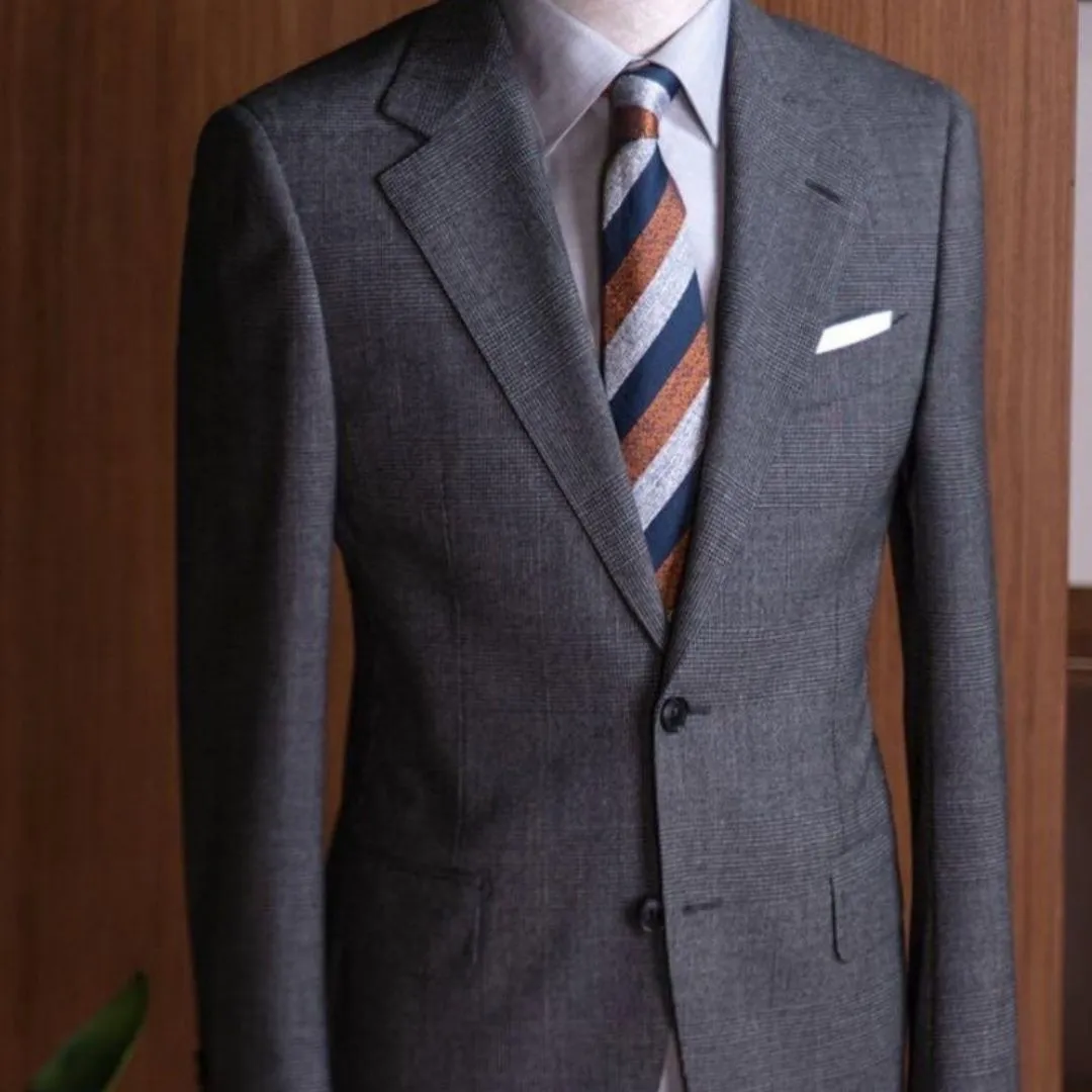 A luxury bespoke wedding suit displayed at Ruman Suits & Shirts, representing the ideal Dubai wedding perfect groom’s suit crafted with premium tailoring.