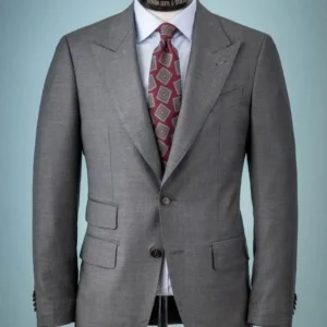 A tailor adjusting a suit jacket, showing the importance of avoiding every suit tailoring mistake to avoid in Dubai for a perfect custom fit.