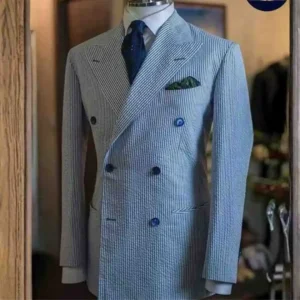 Man carefully hanging a tailored suit in a wardrobe, following professional suit maintenance tips dubai.