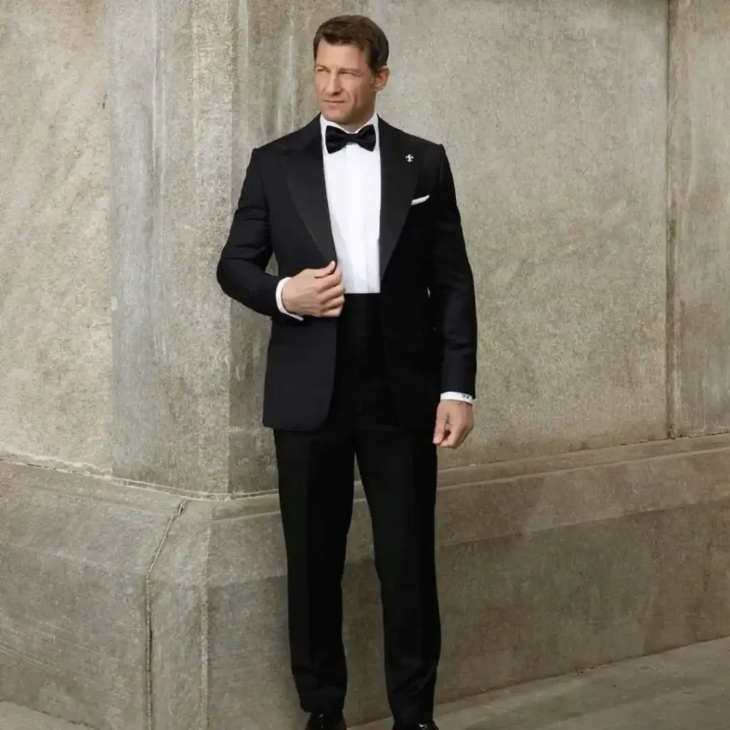 How to Choose the Perfect Custom Tuxedo featuring a perfectly tailored black tuxedo designed for formal events, showcasing premium craftsmanship, elegant fit, and luxury menswear styling.