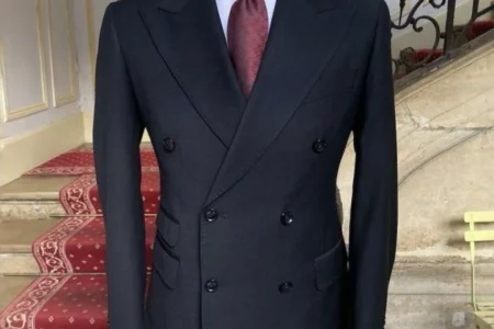 “Master tailor performing precise adjustments on a suit jacket — complete guide to suit alterations Dubai.”