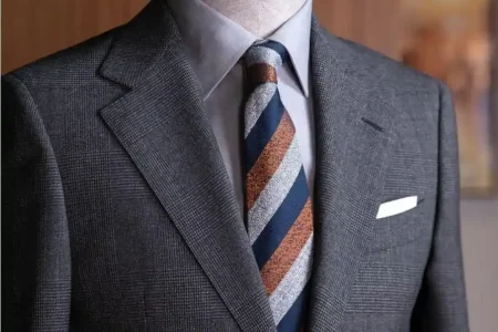 Bespoke suit displayed at Ruman Suits & Shirts, showcasing why Dubai is the leading Dubai hub for luxury mens tailoring.