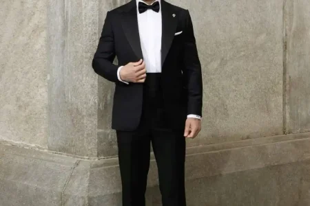 How to Choose the Perfect Custom Tuxedo featuring a perfectly tailored black tuxedo designed for formal events, showcasing premium craftsmanship, elegant fit, and luxury menswear styling.