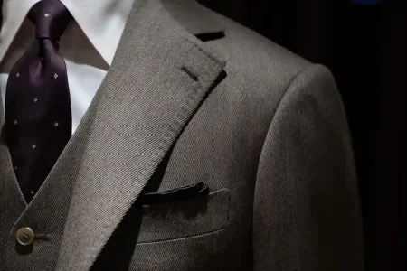 How Often Should You Get Your Suit Altered shown with a tailored suit fitting session and adjustment details for a perfect fit.