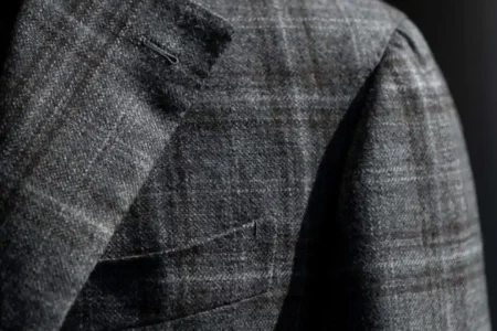 Common Fit Issues That Ruin Expensive Suit including poor shoulder fit, sleeve length errors, and incorrect trouser break